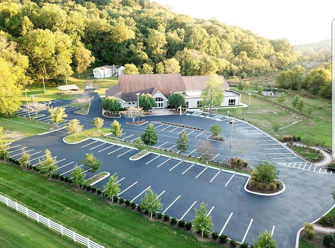 Aerial view of newly paved office parking lot with fresh striping
