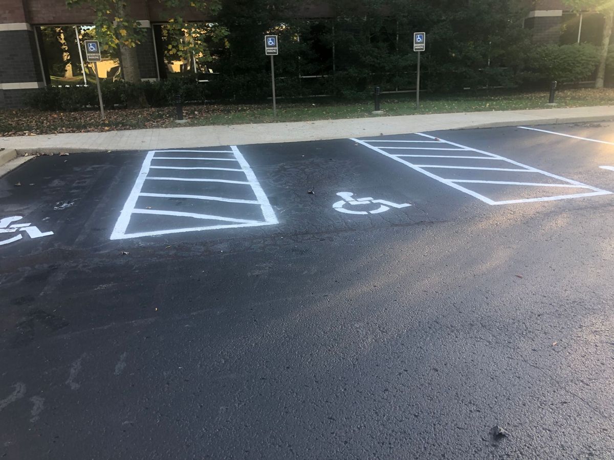Commercial parking lot with fresh asphalt and accessible-stall markings in Middle Tennessee
